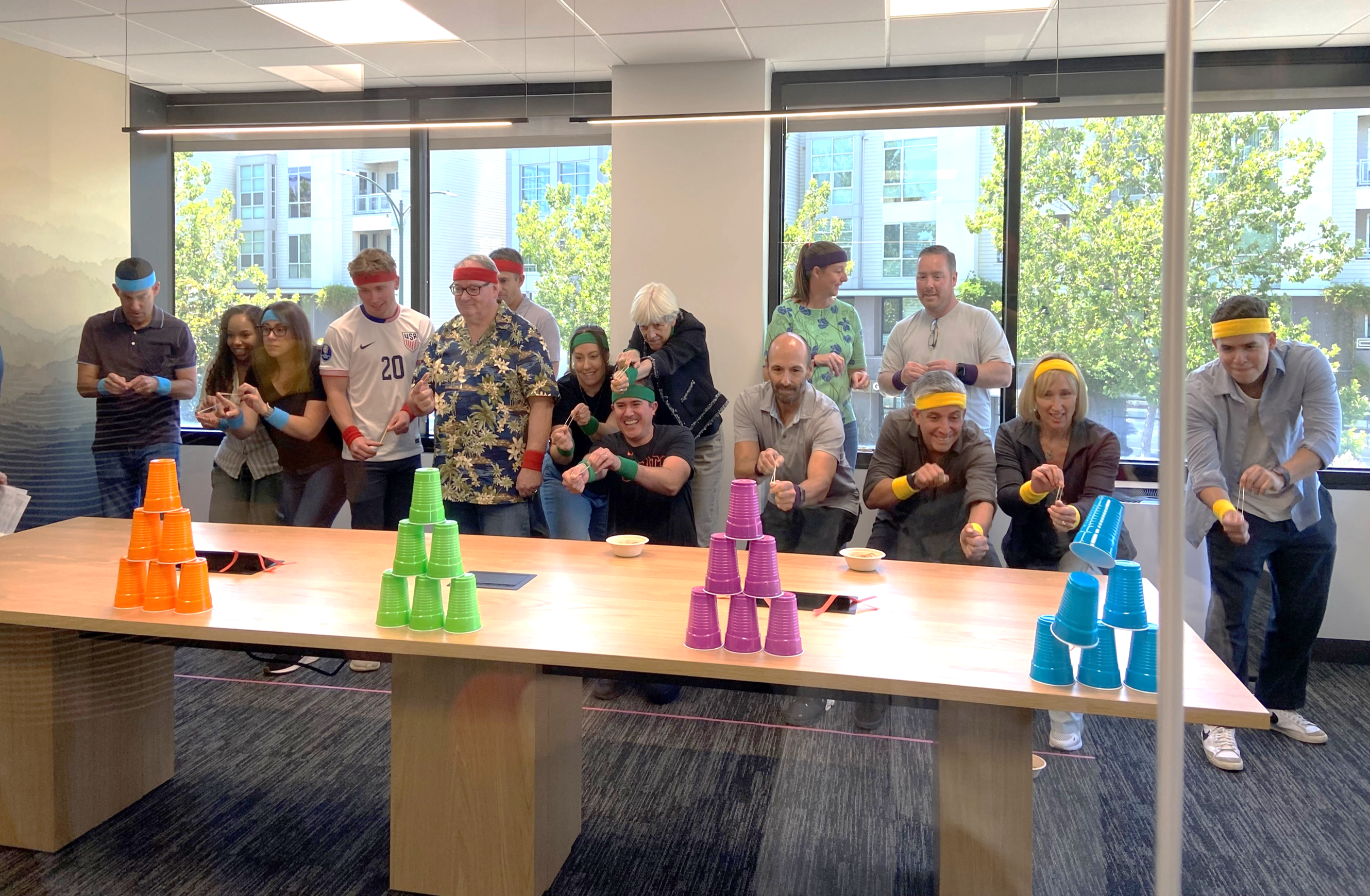 US colleagues teaming up to compete in the 'Office Summer Olympics' event, a series of fun activities.