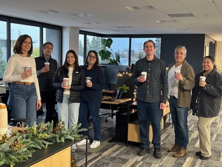 Some of our US colleagues in their office space, complete with plenty of greenery.