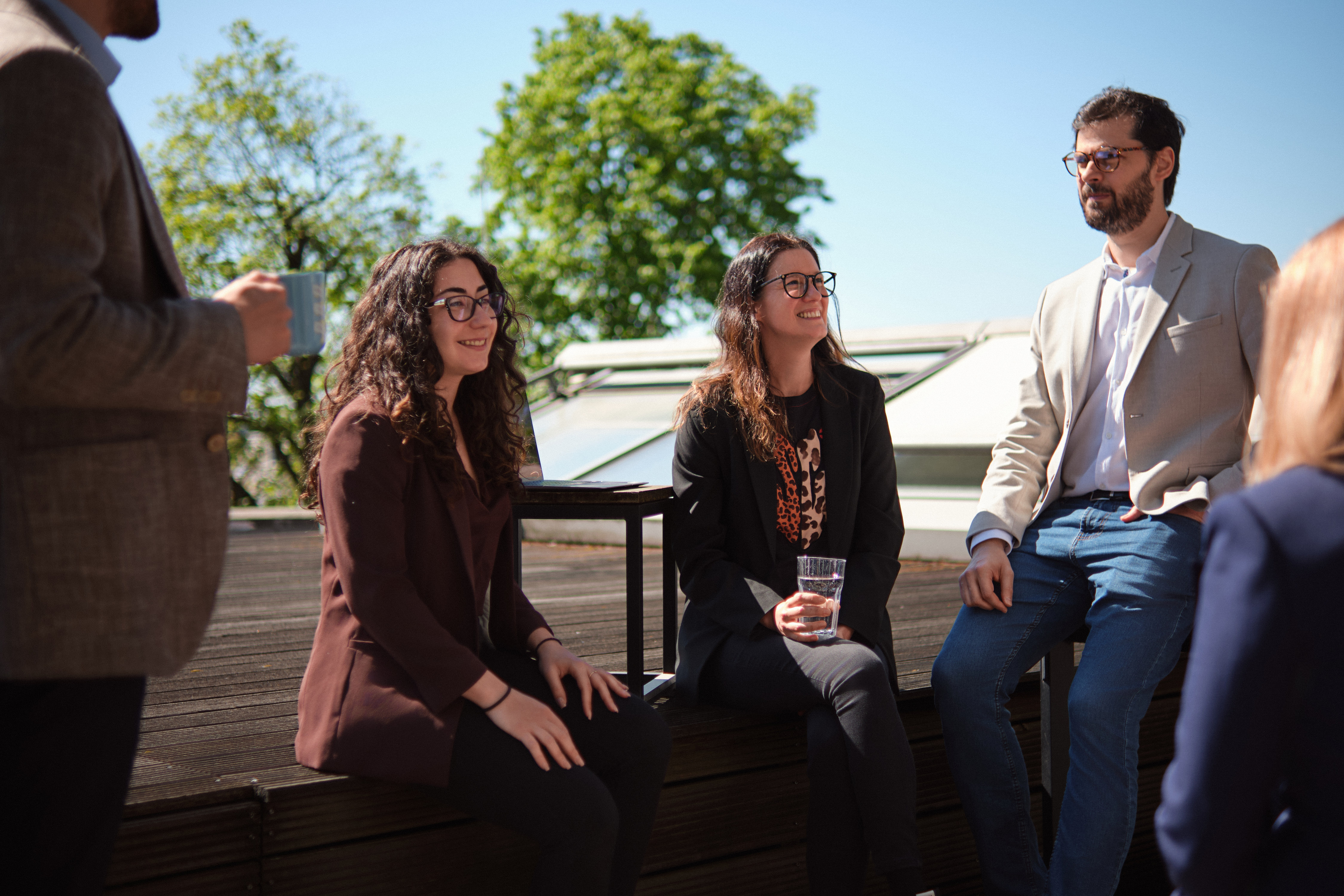 “Work breaks done right: terrace talks and coffee vibes.”